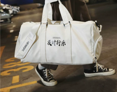 网红港风旅行包女大容量出差行李包男鞋位运动...