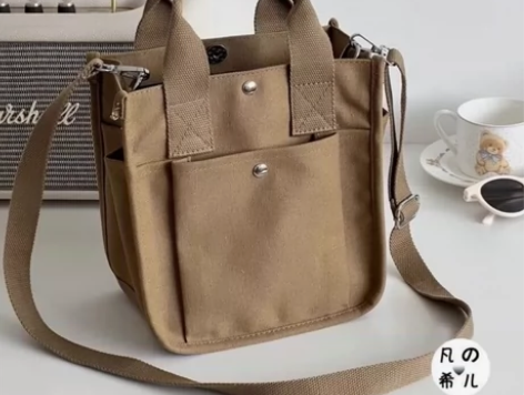 网店倒闭处理一批韩版帆布斜挎包大容量饭盒包...