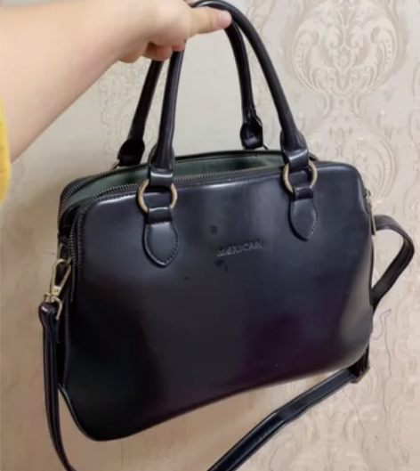 稻草人黑色包PU公文包手提包 感兴趣的话点...