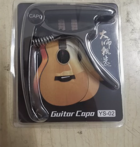 出一个全新未拆封的锌合金吉他变调夹，颜色是...