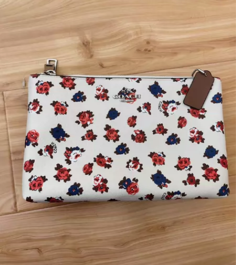 Coach蔻驰老花经典中的经典款牛皮手拿包...