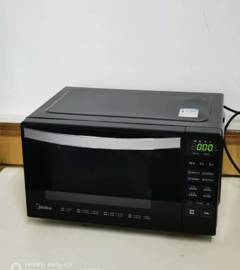#微波炉美的牌子下开门微波炉，黑色的，九成...