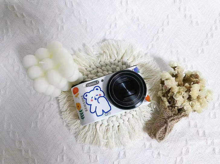 奶白色三星wb150f长焦