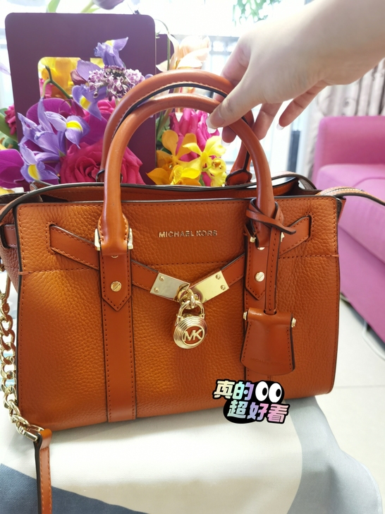 MK经典橙色锁头包
