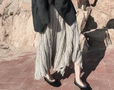 ?秋季不规则裙子中长款流苏重工复古高腰显瘦...