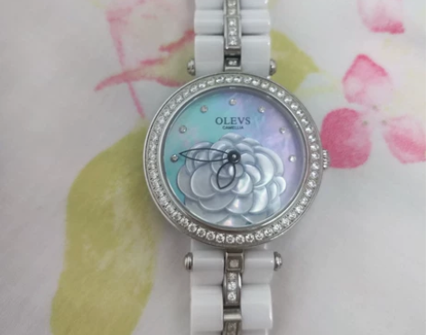 品牌:欧利时时尚白贝母女款手表 颜色:白色...