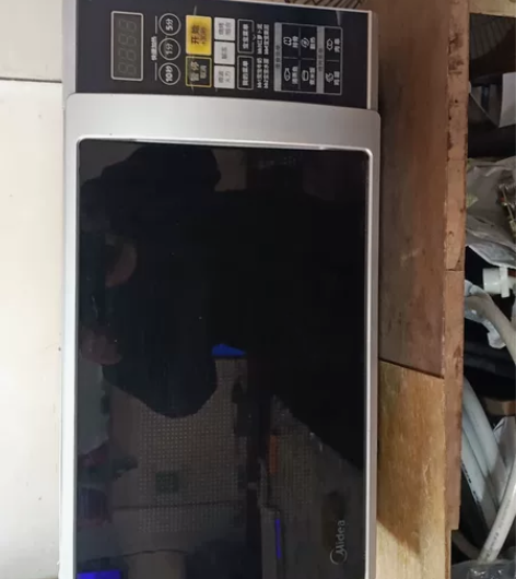 抚顺市望花区海城街下洼美的微波炉150元需...