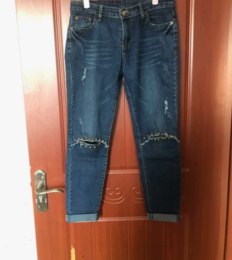 牛仔裤女 膝盖处是开口 里面有蕾丝