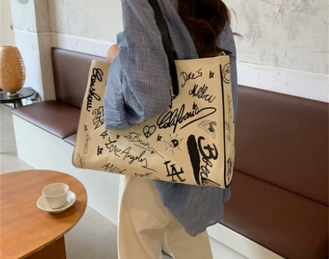 涂鸦帆布包包女2022新款大容量手提托特包...