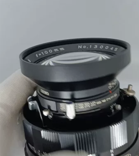 玛米亚新闻机100/2.8，系统最大光圈人...