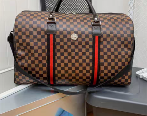 包邮新款pu皮大容量行李包男手提单肩旅游出...