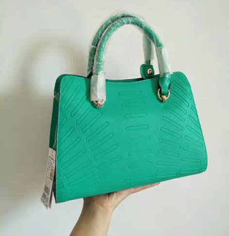 啄木鸟全新时尚手提包甩卖清仓不议价。不包邮...