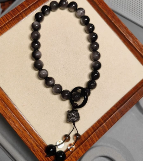 双眼银耀石醒狮手持手串，卡12，一共27颗...